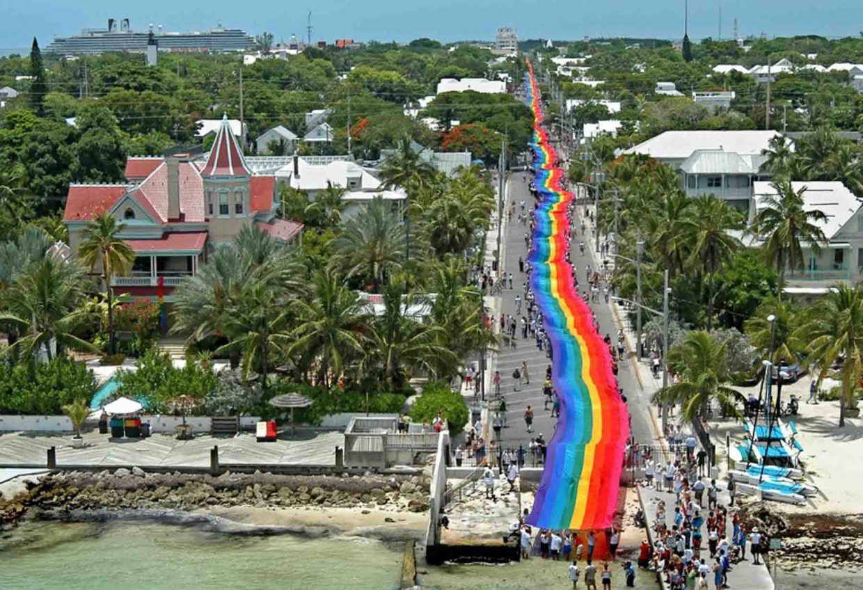An arial view the Pride flag stretched the entire length of Duval Street from Gulf to Ocean