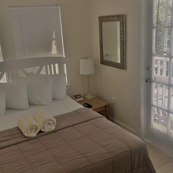 Room 1, a view of the queen-size bed and a view of the private balcony.