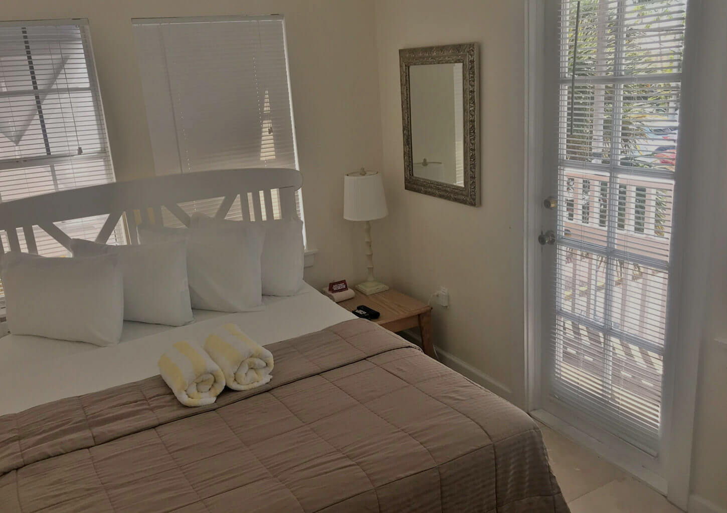 Room 1, a view of the queen-size bed and a view of the private balcony.