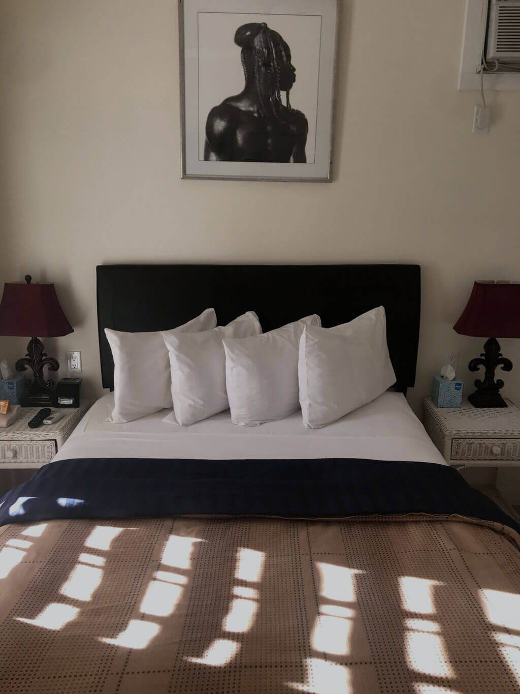 Room 11A, a view of the queen size bed and twin side tables.