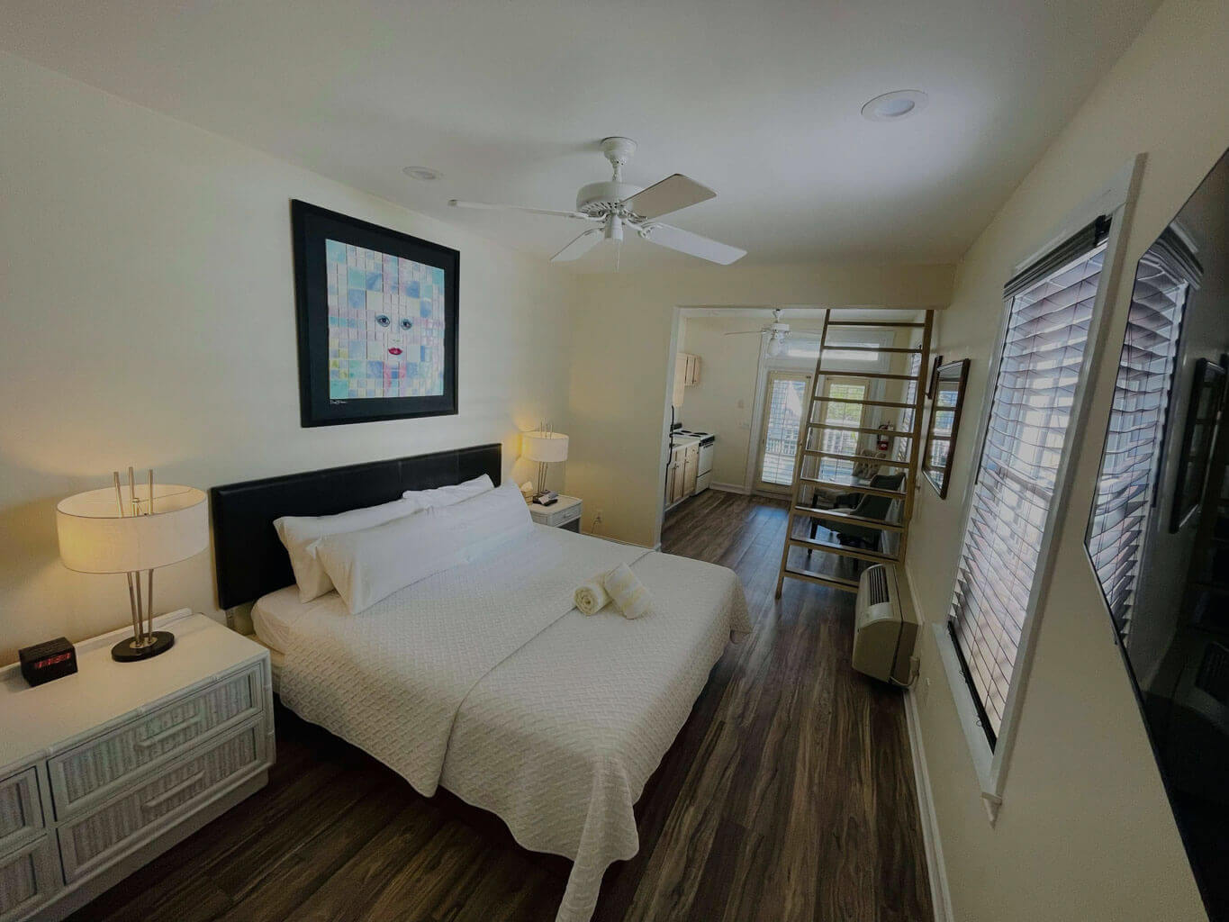 Room 21, a view of the king size bed and French doors opening onto the grand balcony overlooking duval street